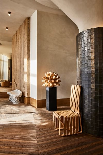 Large warm foyer with tile pillars