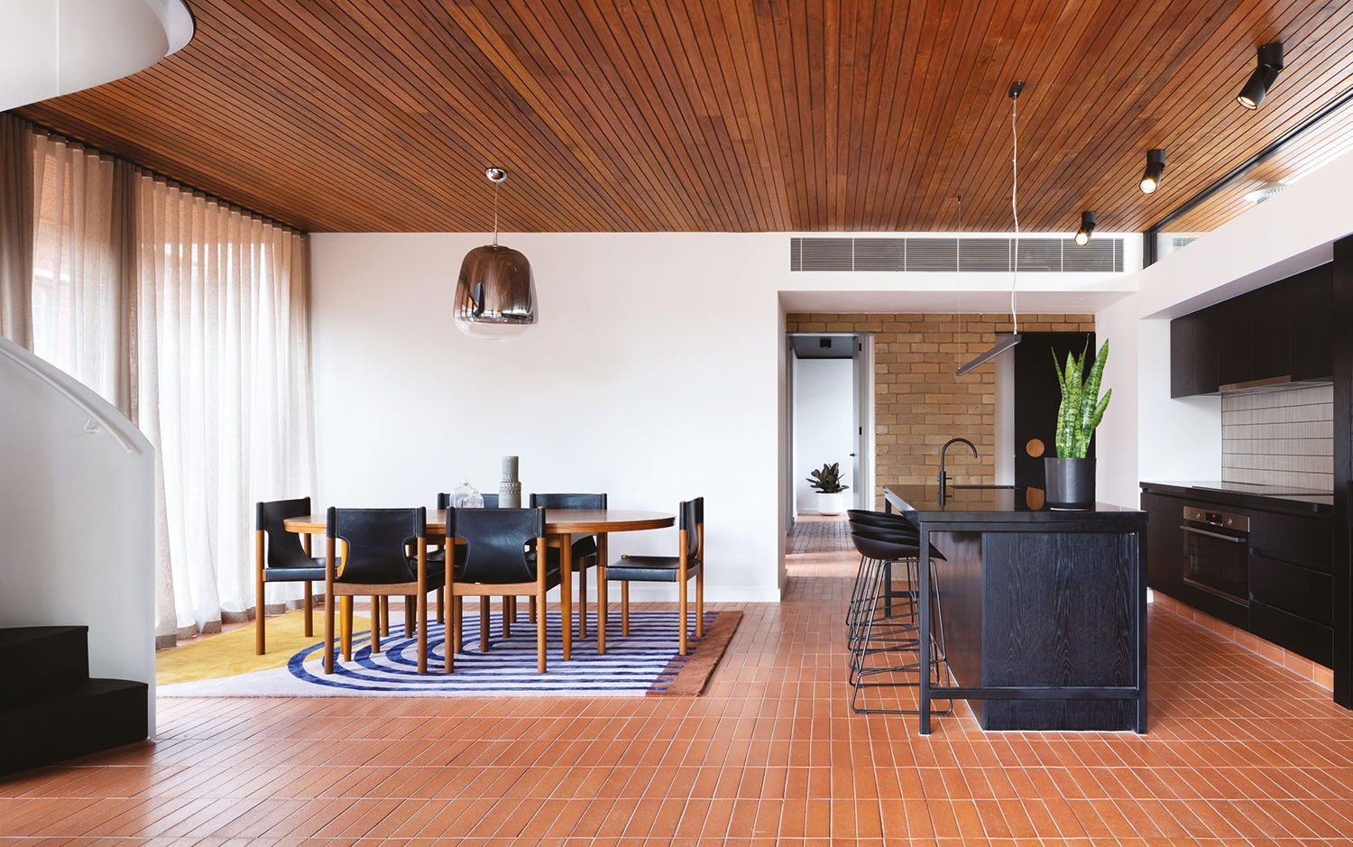 Stacked brick-bond pattern floor featuring Enrico Macchina Terracotta - Satin in rectangular form.