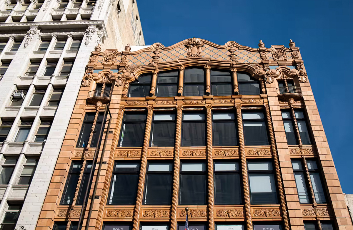 Historic Desmond Building facade in Downtown Los Angeles featuring restored terracotta detailing, balconies, and Spanish Baroque Revival architecture.